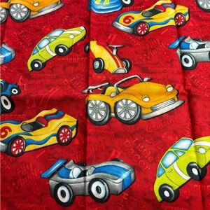 SSI Little Hot Rods fabric. Multicolor race cars on red background. 1 yard cut.